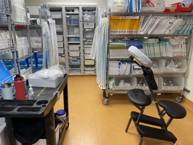 Chair massage station set up in a hospital supply room for staff wellness
