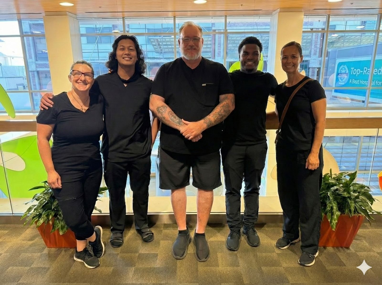Living True team of licensed chair massage therapists at a Sacramento hospital atrium
